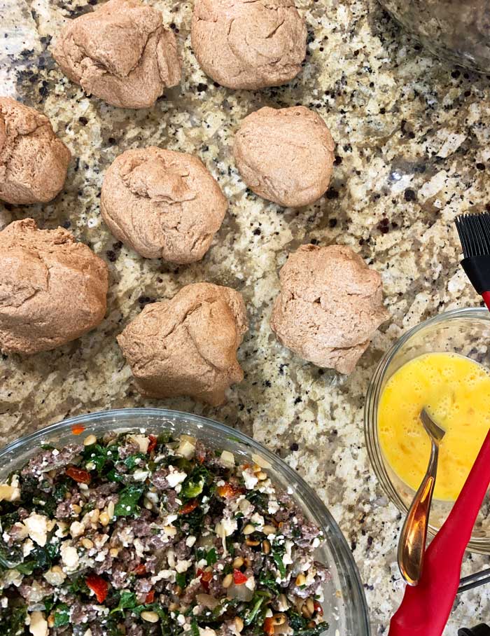 Here you can see the poğaça dough made into balls, the filling, and the egg coating that you'll paint the surface of the finished poğaça with in order to help the seeds stick to the surface + give the baked poğaças a beautiful finish.