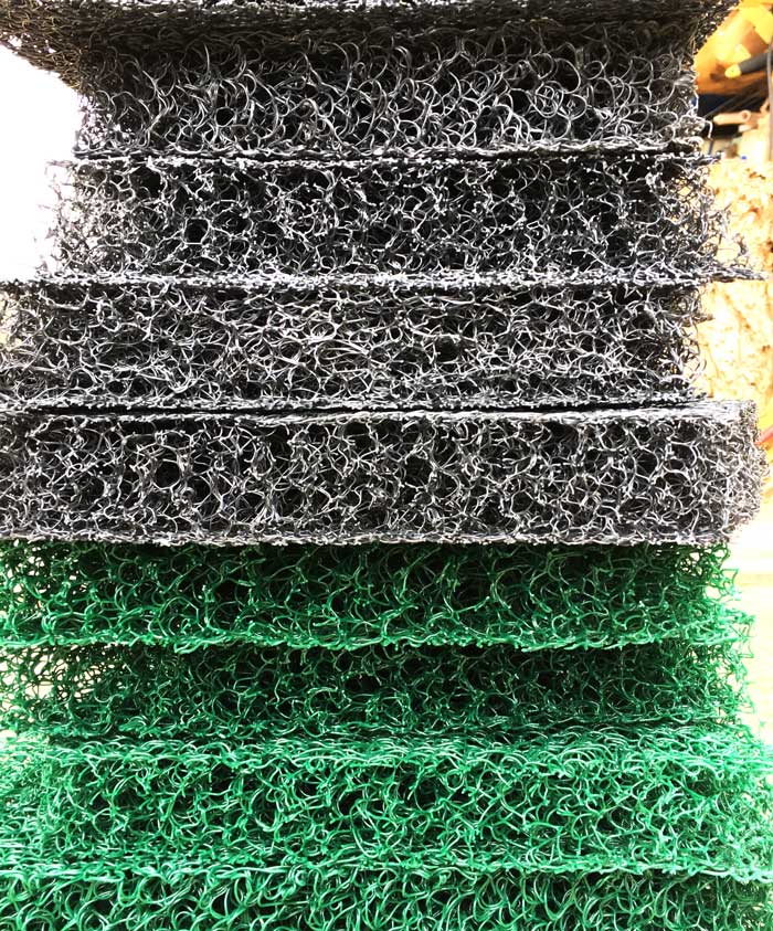 Grey and green Matala filter pad pieces.