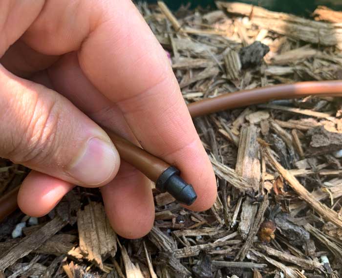 A goof plug closes up the line in each pot and allow the pressure in the line to force water out of the holes.