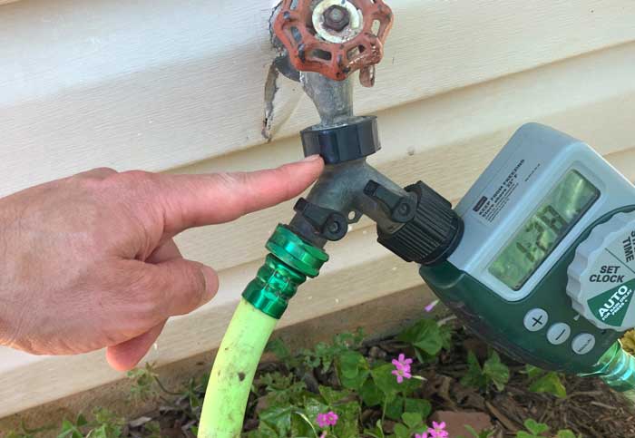 A hose splitter allows us to have a dedicated irrigation line plus still be able to use our spigot for other purposes.