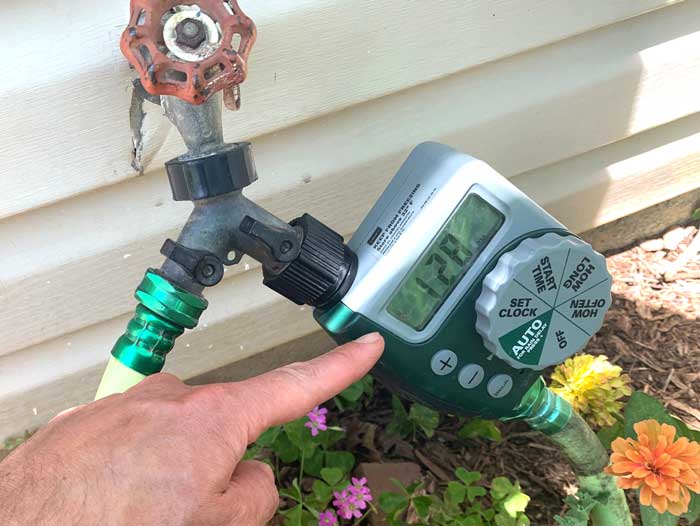An irrigation timer allows our potted plants to be watered whether we're asleep, on vacation, out foraging, or chasing our ducks.