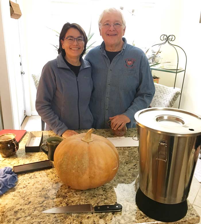 Andrea Deyrup and Tony Williamson in front of a Williamson pumpkin that's about to be made into champagne.