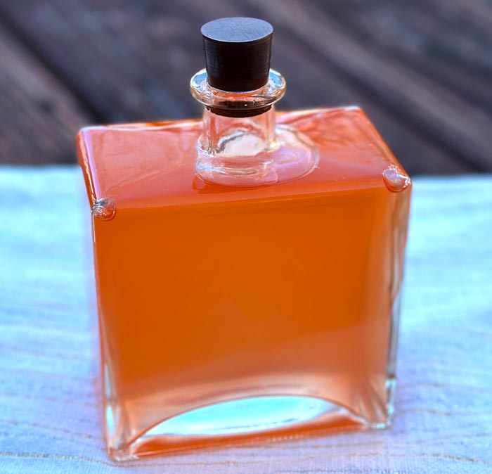 Finished rose flower vinegar ready for the cupboard or to be given as a gift. 