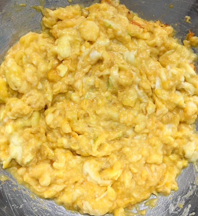 Chunks of pawpaw fruit pulp, separated from the seeds and skin.