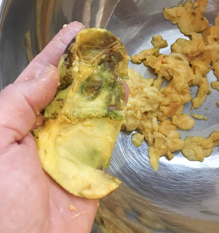 It's kind of hard to tell from this photo, but there's only a thin layer of skin left here. Remember, the skin is bitter so you only want to scrape out the fruit, leaving the skin behind.