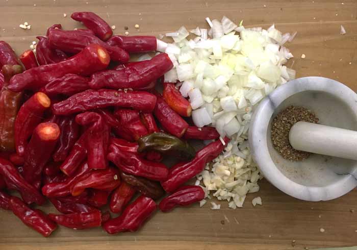 Preparing the ingredients for red Shishito pepper soup: fresh ground coriander seeds (right) add a big flavor boost.
