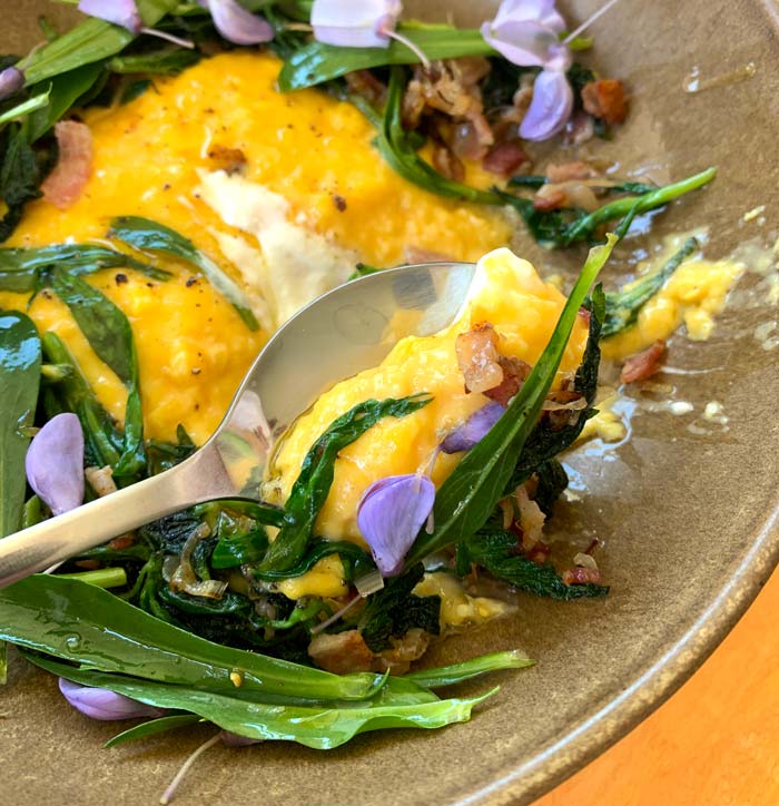 One spoonful of Chef David's soft-scrambled eggs with wilted greens will help you realize that eggs can be gourmet food.