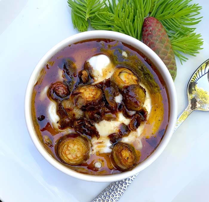 Pan-roasted spruce cones with maple syrup over yogurt. Simple and delicious!