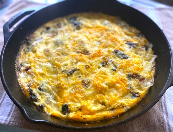 Stinging nettle frittata in cast iron pan.