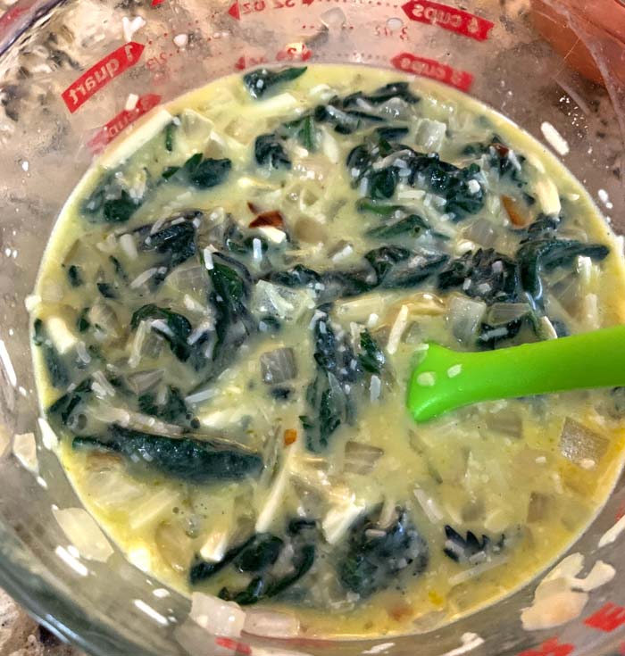 3 cups of quiche filling allows room for rise plus cheese on top in a pie pan that holds 4 cups.