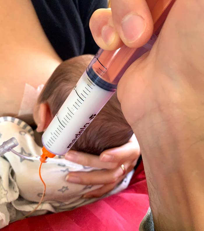 Syringe feeding Sebastian.