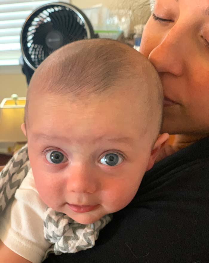 Susan applying one of the 5,000 daily kisses to Sebastian's head.
