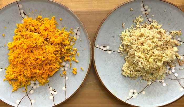 Freshly grated orange and white turmeric ready to be made into turmeric bugs.