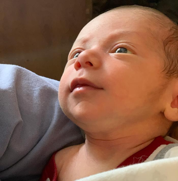 3 week old baby Sebastian bonding with dad, despite dad's lack of mammary glands.