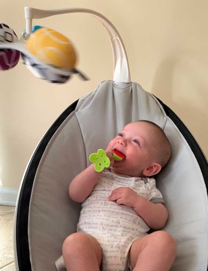 Sebastian enjoying the spinning toys on his Mamaroo plus a favorite silicone fruit chew. Life is good!