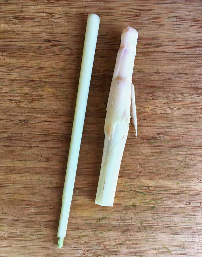 Freshly harvested lemongrass stalks on the cutting board and ready for action.