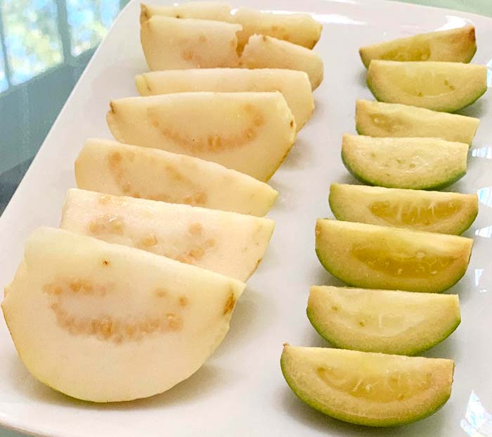 From our trees: Slices of 'Peruvian white' true guavas on the left and 'Mammoth' pineapple guavas on the right. Despite their names, the two plants are not closely related. 
