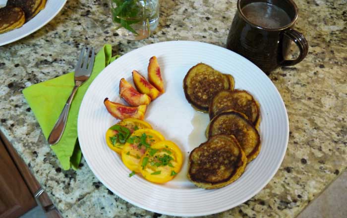 We ate this batch of summer squash pancakes with fresh organic peaches & vine-ripened tomatoes sprinkled with globe basil. The Tyrant was quite pleased with the offering.